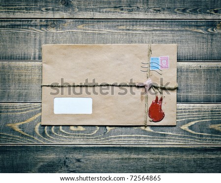 Vintage postal envelope on wooden table