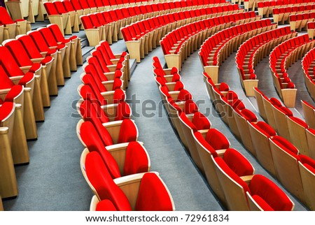 Empty hall for presentation  with red armchairs