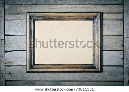 Vintage wooden frame with an empty cardboard
