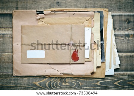 Old envelopes with papers a on wood texture