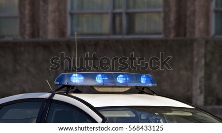 Police car with blue sirens