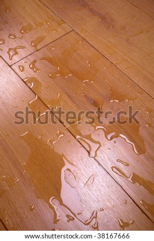 Water has spread on a timber floor