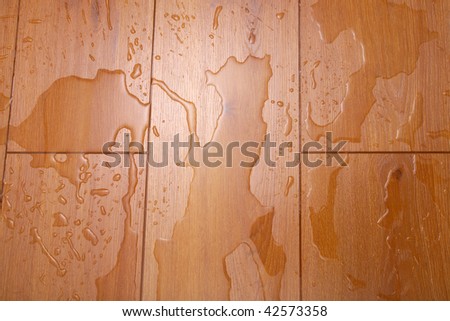 Water has spread on a timber floor