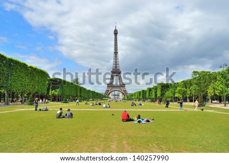 Paris View of Champ de Mars and the Eiffel Tower in a sunny summer day Paris View of Champ de Mars and the Eiffel Tower in a sunny summer day