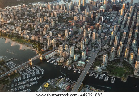 Aerial Photography of False Creek in Downtown Vancouver, BC, Canada, on a Hazy sunny sunset.
