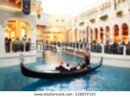Blurry vision in Venice, with gondolas in canal