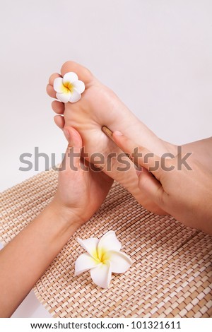 Close-up of thai massage foot female isolated on white background