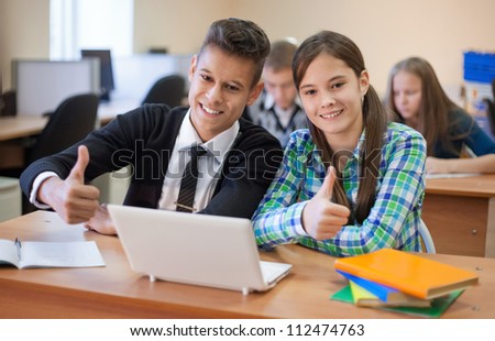 Young students showing success in the classroom