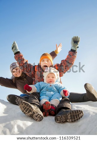 Happy family having fun together at winter