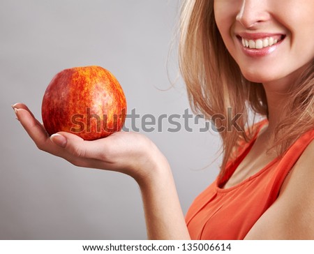 Beautiful woman holding apple on her hand - diet concept