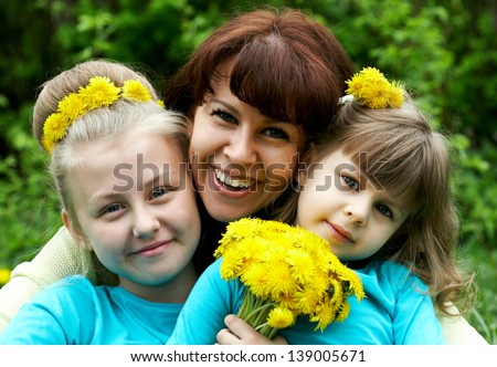 Group of smiling mother and two girls