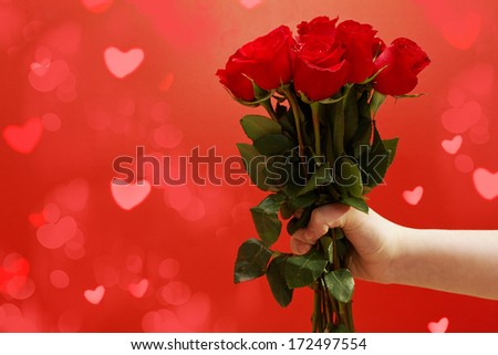 male hands holding roses -love concept