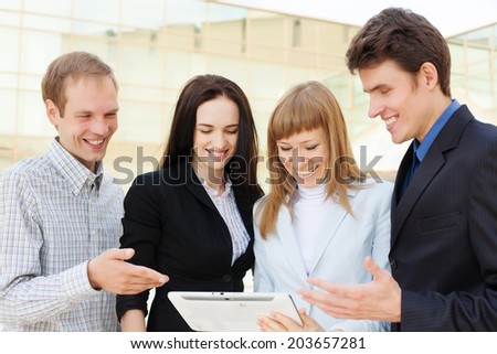 Group of happy business people talking outside