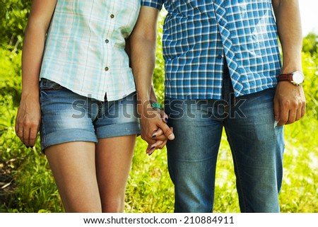Young couple in love holding by hands