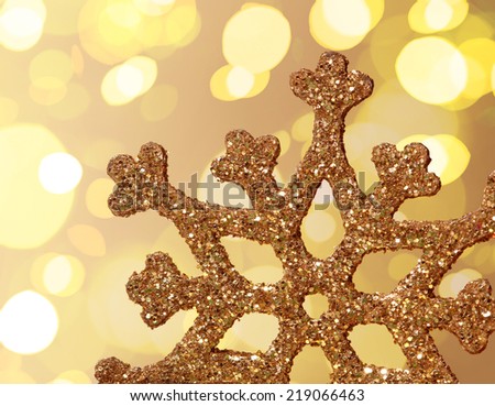 Gold star with light on the background