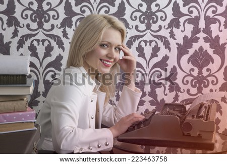Happy book writer woman with smile looking at camera. Retro style photo