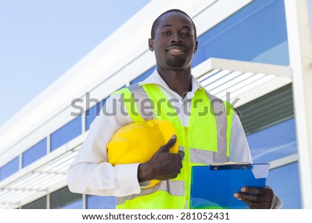 Happy Worker inspector  near modern building