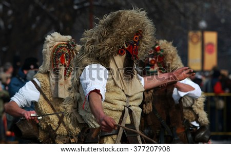 Unidentified mans in traditional Kukeri costume is seen at the Festival of the Masquerade Games Surva in Pernik, Bulgaria