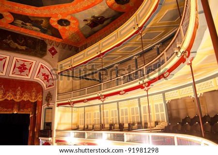 Balconies inside a theater, the nineteenth century, built of wood. Neoclassical style.