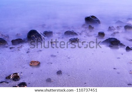 Stones in the water of Atlantic ocean, Tenerife, Canary islands, Spain