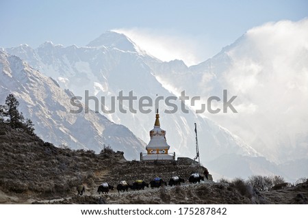 Tenzing Norgay Monument on the way to Everest base camp, yak caravan and Everest mountain, Himalaya mountains, Nepal