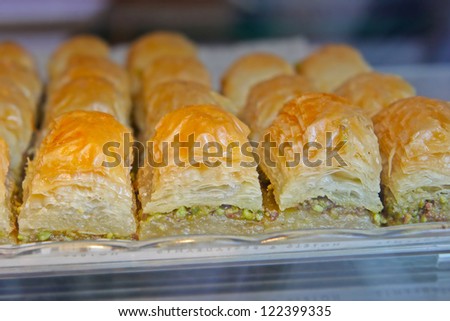 The baklava (a dessert made of thin pastry, nuts, and honey)