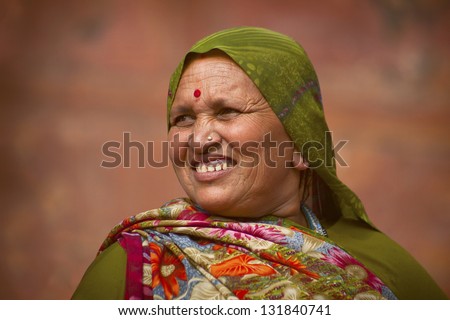 AGRA, INDIA - NOVEMBER 18, 2012. Portrait of Rajasthani woman near Agra Fort, during holy festival , November 18 2012.  Agra is the ancient city, attracting Indians from all over the subcontinent.