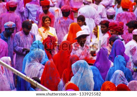 JAIPUR, INDIA - MARCH 17: People covered in paint on Holi festival, March 17, 2013, Jaipur, India. Holi, the festival of colors, marks the arrival of spring,  one of the biggest festivals in India