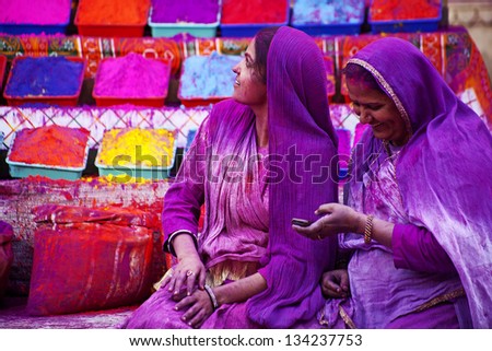 JAIPUR, INDIA - MARCH 17: Lady in violet, on Holi festival, March 17, 2013, Jaipur, India. Holi, the festival of colors, marks the arrival of spring, one of the biggest festivals in India