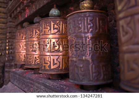 Tibetian prayer wheels. Selective focus . Kathmandu, Nepal