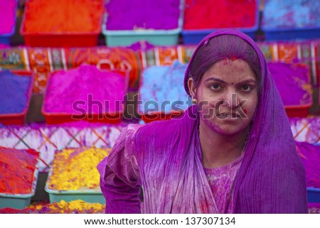 JAIPUR, INDIA - MARCH 17: Lady covered in paint on Holi festival, March 17, 2013, Jaipur, India. Holi, the festival of colors, marks the arrival of spring, one of the biggest festivals in India