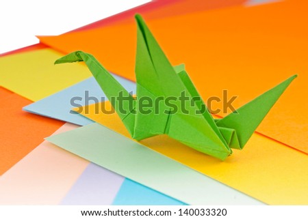 Colourful origami birds and paper