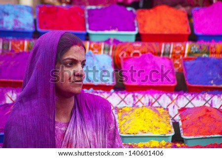 JAIPUR, INDIA - MARCH 17: Lady covered in paint on Holi festival, March 17, 2013, Jaipur, India. Holi, the festival of colors, marks the arrival of spring, being one of the biggest festivals in India
