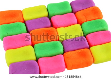 Pieces of wall made of colorful plasticine bricks