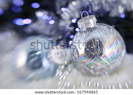 Christmas balls on the bright garland background