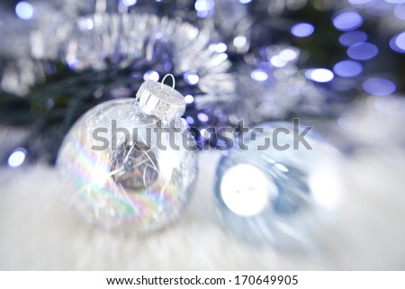 Christmas balls on the bright garland background