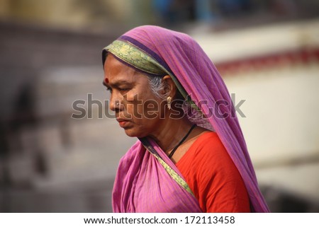 VARANASI - NOVEMBER 22: Unidentified hindu women  on the sacred Ganges river banks at Dashashwamedh ghat on November 22, 2012 in Varanasi, State of Uttar Pradesh, India