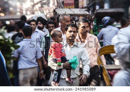 DELHI, INDIA - NOVEMBER 10: Morning on a street at November 10, 2013 in Old Delhi, India. Indian capital still uses man powered rickshaws as a usual mean of transport