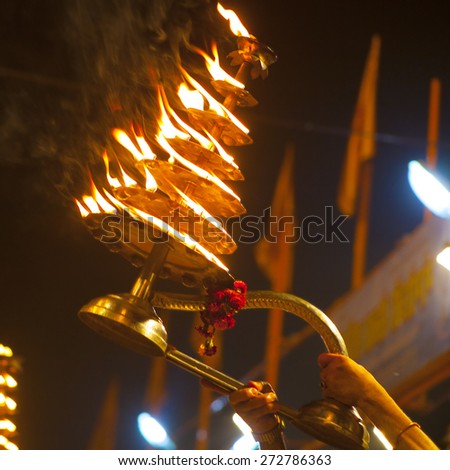 VARANASI, INDIA - NOVEMBER 25: An unidentified Hindu priest conducts religious Ganga Aarti ritual (fire puja) at Dashashwamedh Ghat on November 25, 2012 in Varanasi, Uttar Pradesh, Central India