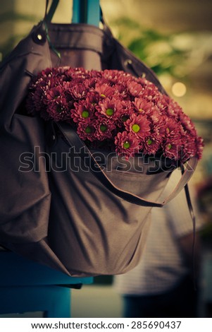 violet flowers in bag