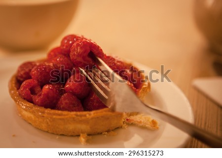 sweet basket with cream and raspberries