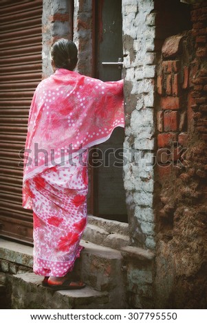 VARANASI - NOVEMBER 22: Unidentified hindu women on the streets of sacred Varanasi old town on November 22, 2012 in Varanasi, State of Uttar Pradesh, India