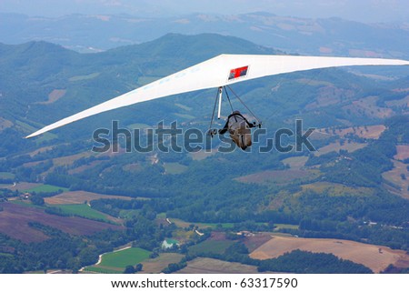 MONTE CUCCO, ITALY - AUGUST 12: Competitor of the Dutch Open-2010 hang gliding competitions taking part on the Monte Cucco mountain on August 12, 2010 near Cigillo, Italy.