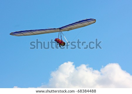 MONTE CUCCO, ITALY - AUGUST 12: Competitor  of the Dutch Open-2010 hang gliding competitions takes part on the Monte Cucco mountain on August 12, 2010 near Cigillo, Italy.