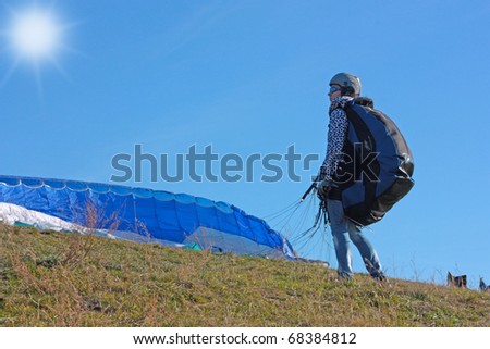 CRIMEA, UKRAINE - SEPTEMBER 9: Competitor of the para gliding competitions takes part in the Klementieva mountain on September 9, 2010 in Crimea, Ukraine