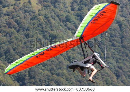 TOLMIN, SLOVENIA - AUGUST 20: Competitor  takes part in the Kobala Open-2011 hang gliding competitions on August 20, 2011 near Tolmin, Slovenia.