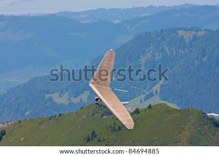 FIESH, SWITZERLAND - JULY 8: Competitor takes part in  the Fiesh Open hang gliding competitions takes part on July 8, 2011 in Fiesh, Switzerland