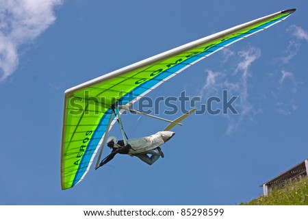FIESH, SWITZERLAND - JULY 8: Competitor  takes part in the Fiesh Open hang gliding competitions takes part on July 8, 2011 in Fiesh, Switzerland