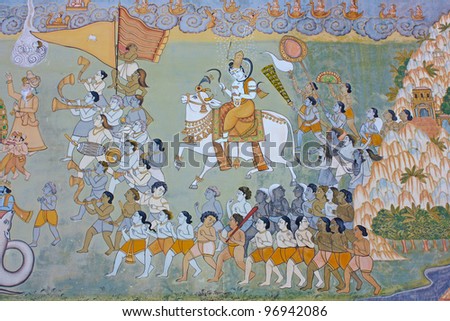 Colorful indian mural in the fort at Jodhpur showing a royal procession, including elephant and courtiers from the Rajput era