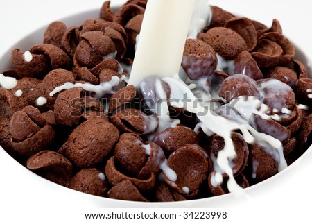 Chocolate shells in bowl with milk